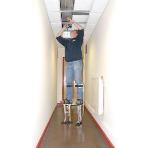 An electrician using the Faithfull stilts